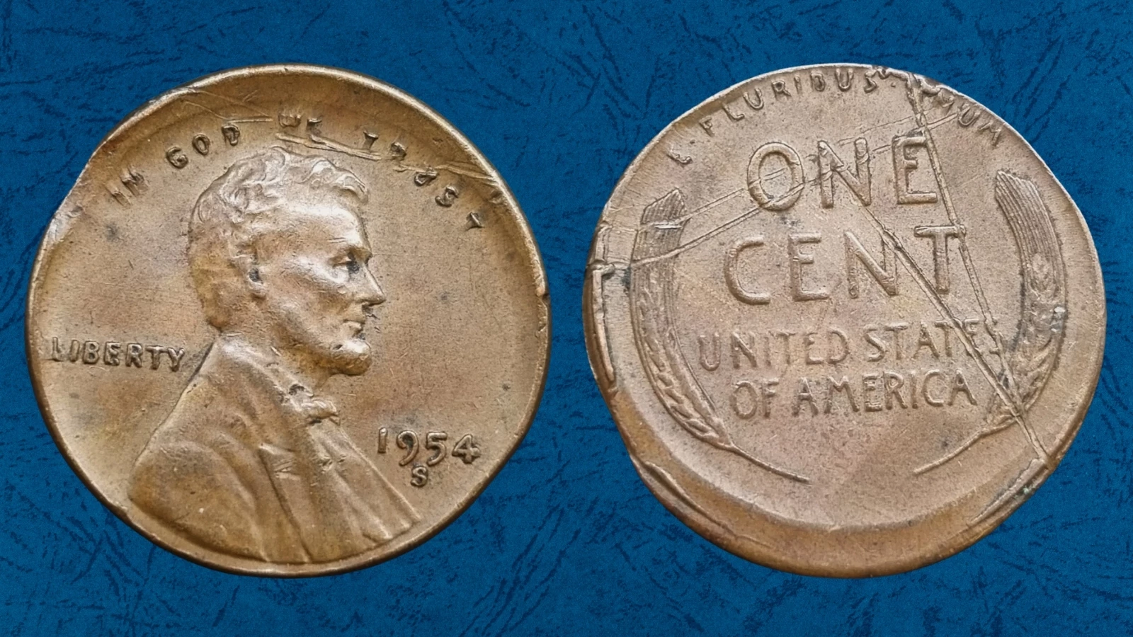 1954 wheat penny off-center strike error showing Lincoln design shifted from center with blank planchet crescent visible